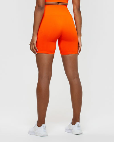 Orange nike biker shorts sales